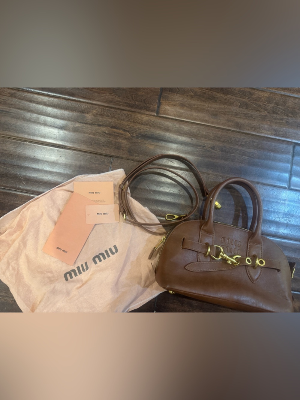 M I u  Brown Leather Satchel with Gold Hardware. No brand